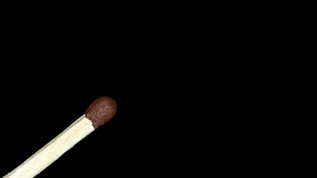Scattered matches on a black background