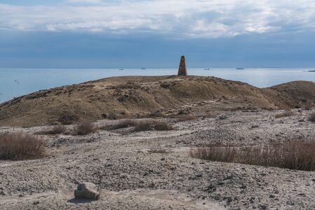 Old abandoned lighthouse on the shoreの写真素材