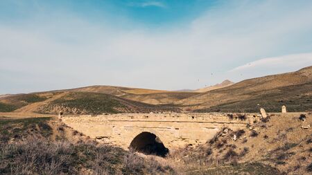 Old stone bridge over the dried riverの写真素材