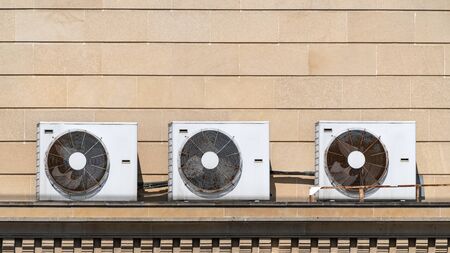 Air conditioning units on house roofの写真素材