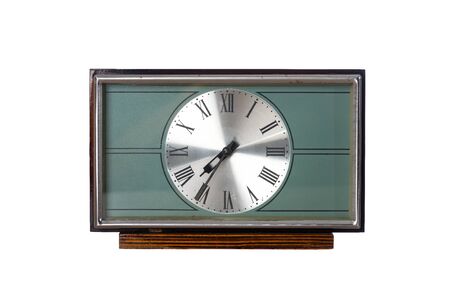 Old mechanical desk clock isolated on white background