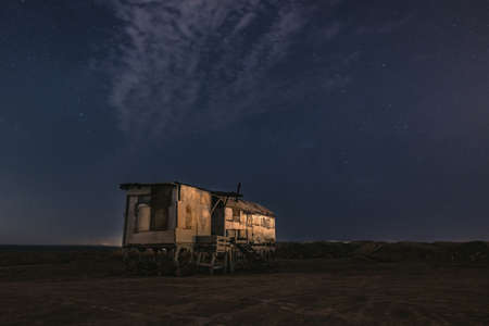 Old fishing hut in the nightの写真素材