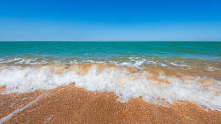 Beach with turquoise sea and yellow sand, resort summer background