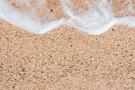 Sea sand with water splashの写真素材
