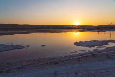 Dried up salt lake at sunriseの写真素材