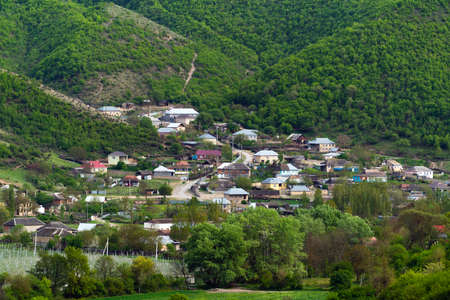 A village at the foot of the Caucasian mountain rangeの写真素材