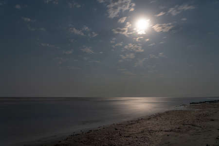 Seashore on a moonlit nightの写真素材