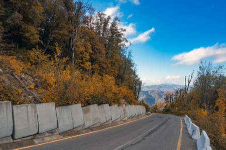 Asphalt road in mountainous area in autumnの写真素材
