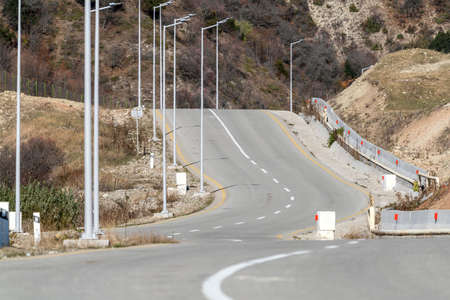 Turning on an asphalt mountain roadの写真素材