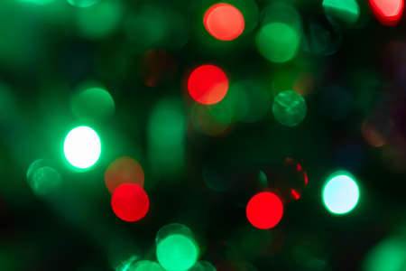 Multicolored christmas bokeh lights backgroundの写真素材