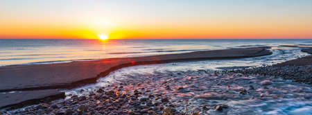 Colorful seashore at dawn timeの写真素材