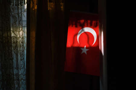 Turkish flag lit by the sun raysの写真素材