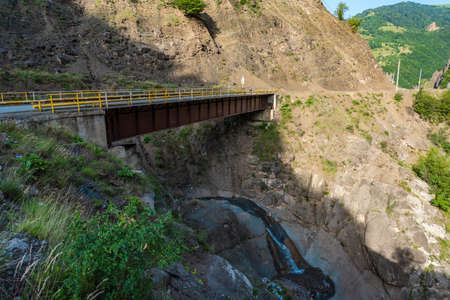 Bridge over a river in a mountain gorgeの写真素材