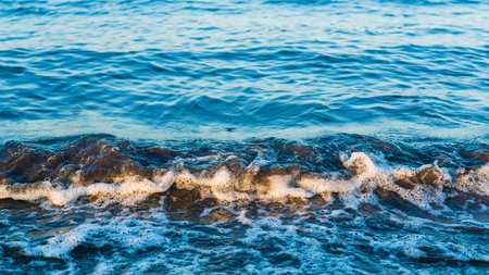 Small waves on the sea beachの写真素材