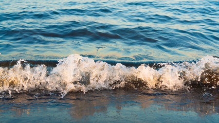 Small waves on the sea beachの写真素材