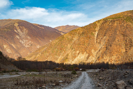 Dirt road in mountainous areaの写真素材