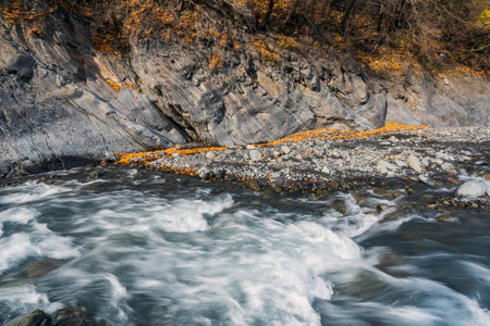 Fast mountain river in autumn seasonの写真素材
