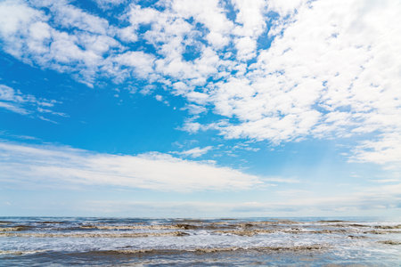 beautiful seascape with clouds and blue sky on sunny dayの写真素材