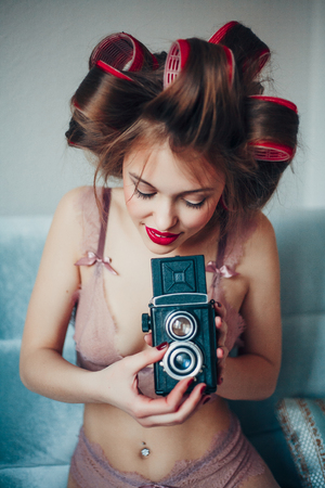 Beautiful young woman. Professional make-up and hairstyle. Perfect skin. Fashion photo.の写真素材