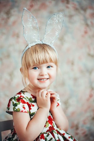 Fun Portrait of a cute little girl with bunny ears.