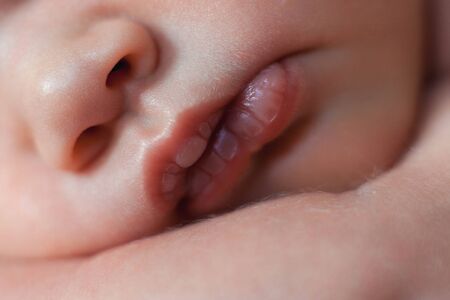 Close up photo of newborn baby lips.の写真素材
