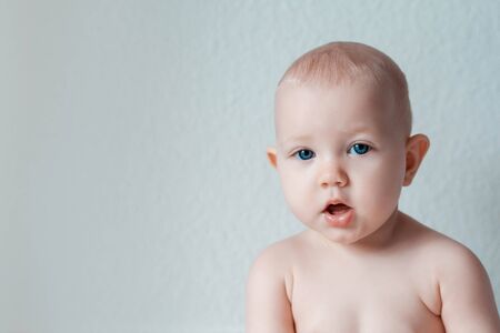 Authentic portrait of cute 8 months old baby girl.の写真素材