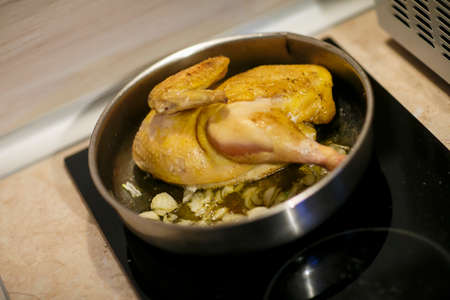Healthy food cooking in steamer, steam cooker with green, yellow and red bell pepper, onion and chicken liver, selective focusの写真素材