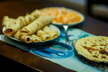 Pancakes with strawberries, nuts and maple syrup