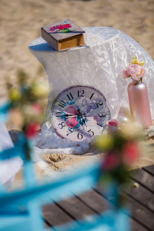 Wedding on the beach. Wedding arch decorated of blue material and flowers on tropical white sand beach. Wedding and honeymoon concept.の写真素材