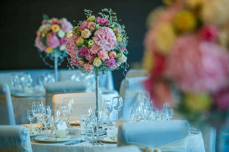 Elegant floral set up for an wedding event with candles lit