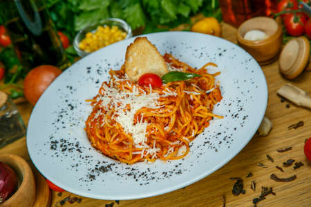 Pasta with meat, tomato sauce and vegetablesの写真素材