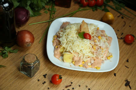 close up delicious homemade salad boiled potatoes corn sauce grated parmesanの写真素材