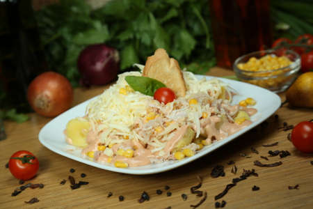 close up delicious homemade salad boiled potatoes corn sauce grated parmesanの写真素材