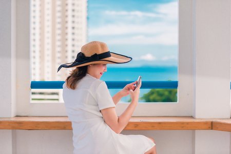 Woman was video call with his friend over the phoneの写真素材