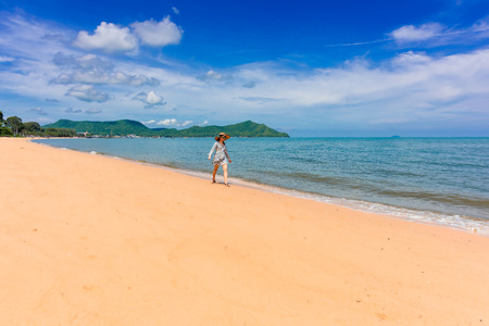 Woman traveler is enjoying the beautiful sea view on her holiday.の写真素材