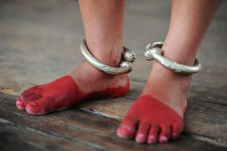 Local dancer's red painted feet with silver rings in Nepalの写真素材
