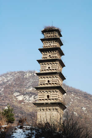 Landmark of an ancient pagoda on the top of mountainsの写真素材