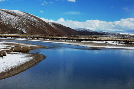 Landscape of mountains and river in winterの写真素材