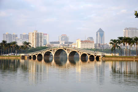 Landscape of ancient bridge over the river in the urban areaの写真素材