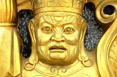 Closeup view of a golden statue of buddhaの写真素材