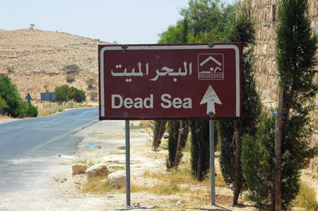 Road sign of Dead Sea at the roadside in Jordanの写真素材