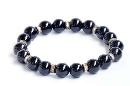 Bracelet made of black pearls on a white backgroundの写真素材
