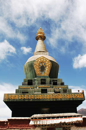 Landmark of a historic green pagoda against blue skies in a famous Tibetan lamasery
