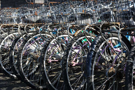 Old bicycles parked in a rowの写真素材