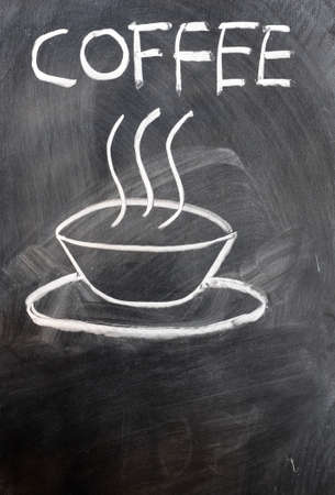 Coffee cup and word written on a blackboardの写真素材