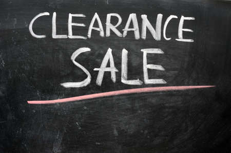 Clearance sale written with chalk on a blackboardの写真素材
