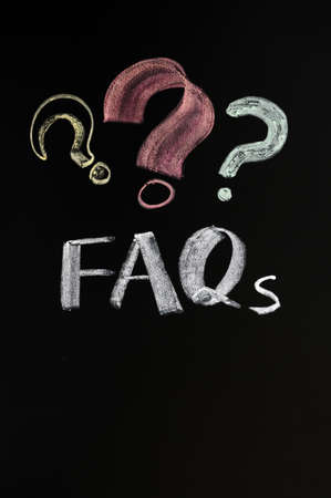 FAQ concept with question marks on a blackboard