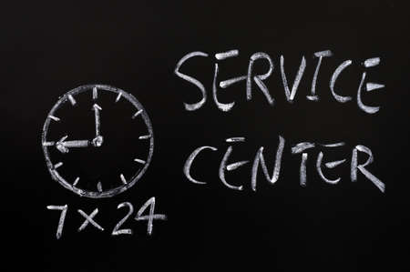 Service center working hours written in chalk on a blackboard