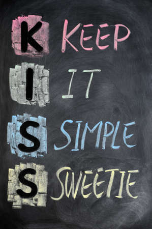 KISS acronym written in colorful chalk on a blackboard KISS acronym written in colorful chalk on a blackboard