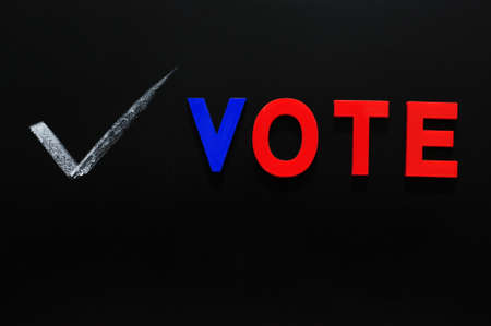 Vote made of colorful letters on a blackboardの写真素材